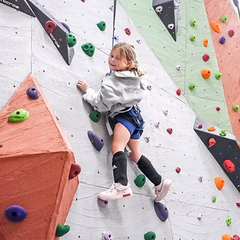 Child rock climbing.