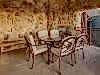 Outdoor seating and fireplace on suite deck at Grand Cascades Lodge